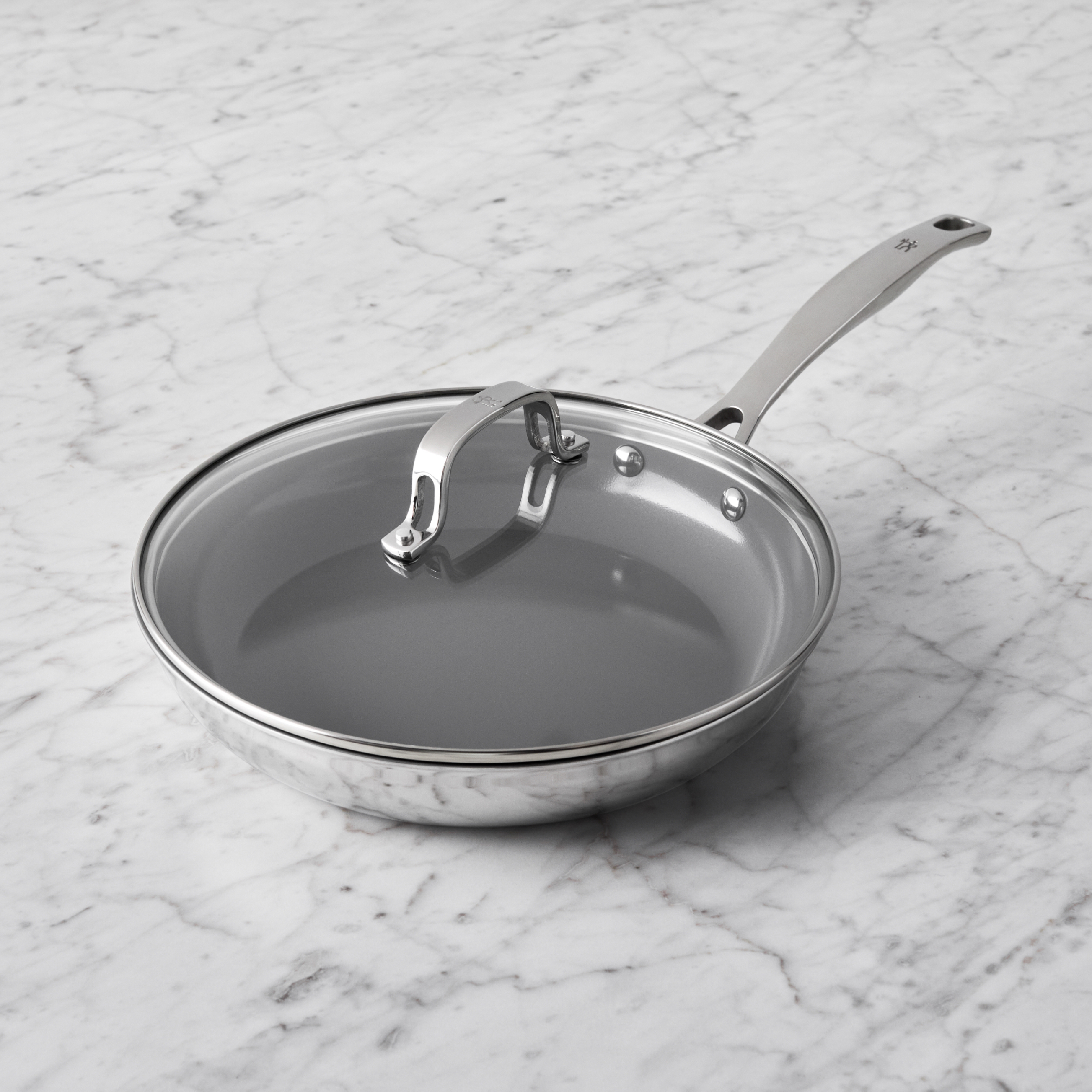 https://www.zwilling.com/on/demandware.static/-/Sites-zwilling-us-Library/default/dw9ce2fb19/images/product-content/masonry-content/henckels/cookware/henckels-h3/H3COATED_05.jpg